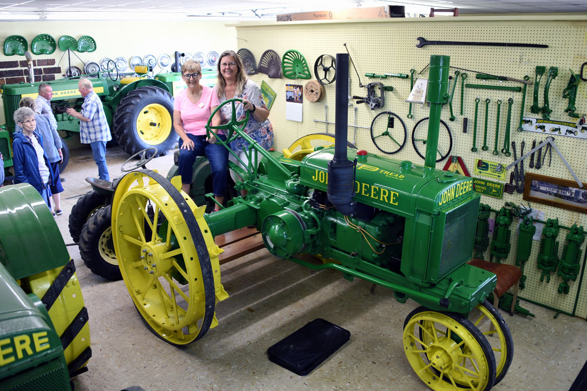 022 Nancy Heinrichs and Cynthia Bolte on a 1931 John Deere GP.JPG